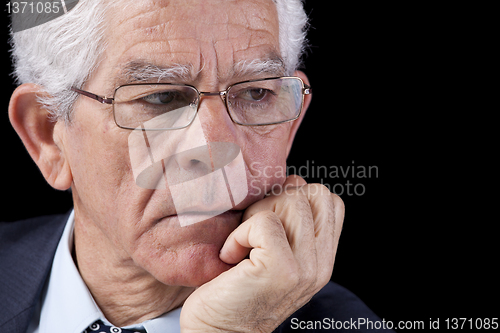 Image of Senior businessman thinking