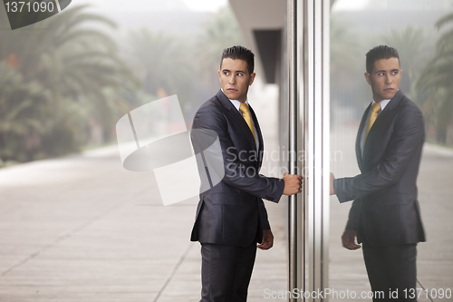 Image of Businessman open the office door