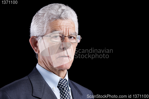 Image of Senior businessman looking