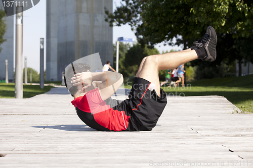 Image of Athlete man making abdominals