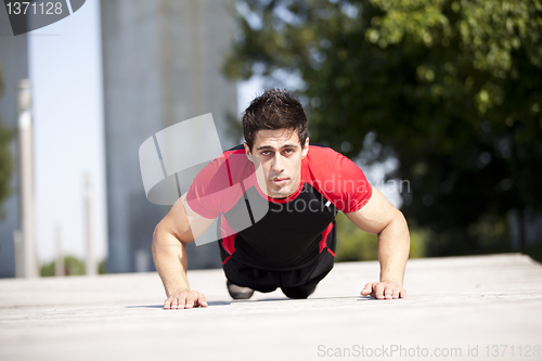 Image of Athlete man making pushups