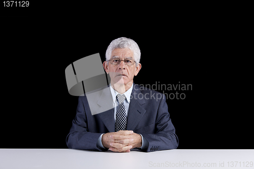 Image of Senior man at the desk