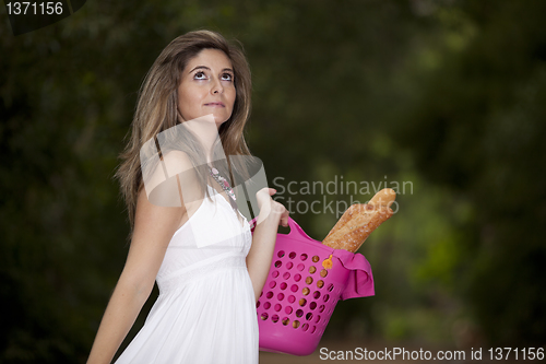 Image of Woman with bread in the basket