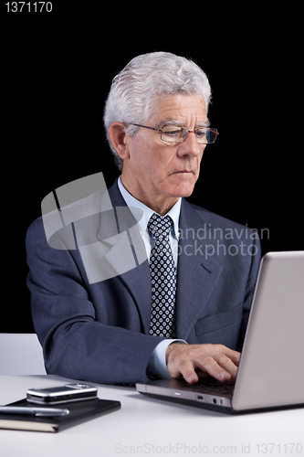 Image of Senior businessman at the office