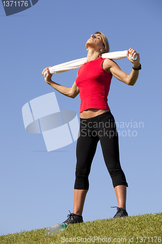 Image of sport woman with a towel