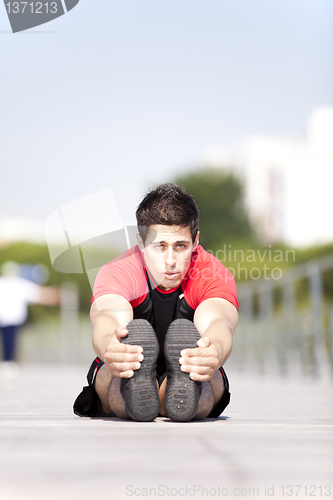 Image of Athlete warming and stretching