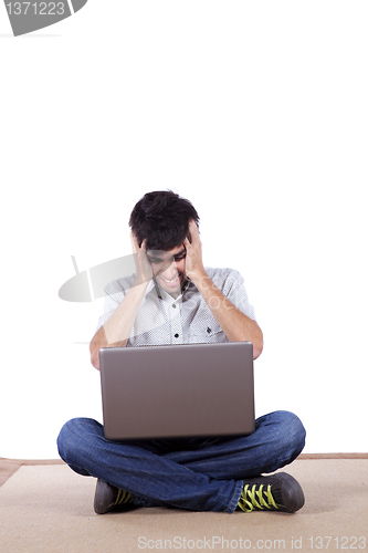 Image of Young working with his laptop