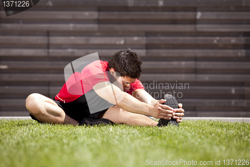 Image of Athlete warming and stretching