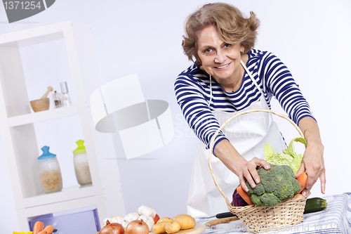 Image of Senior woman cooking