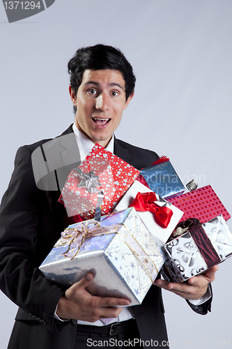 Image of Businessman with many gift packages