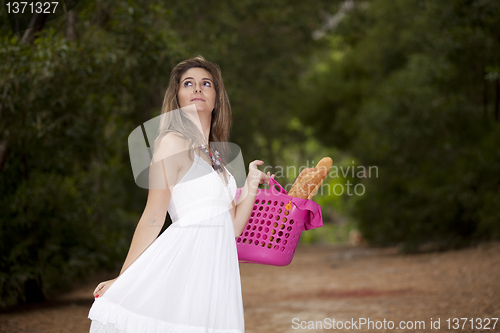 Image of Woman with bread in the basket