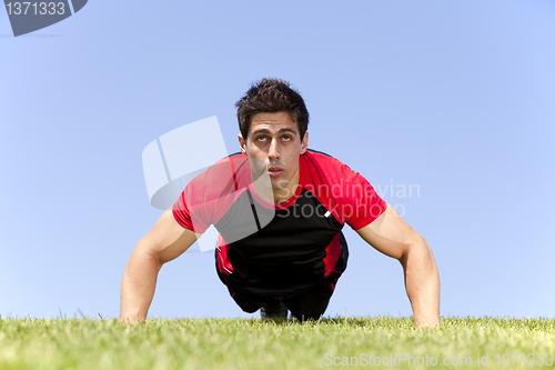 Image of Athlete man making pushups