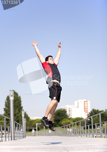 Image of Athlete jumping at the park