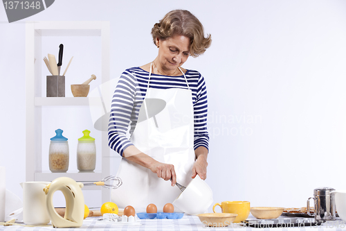 Image of Senior woman cooking