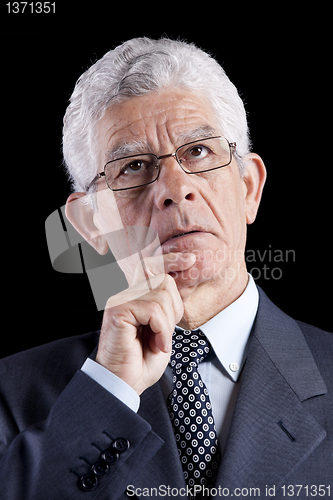 Image of Senior businessman looking up