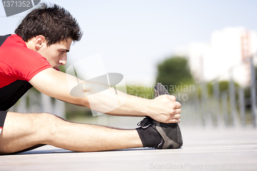 Image of Athlete warming and stretching