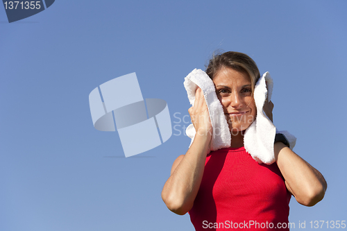 Image of sport woman with a towel