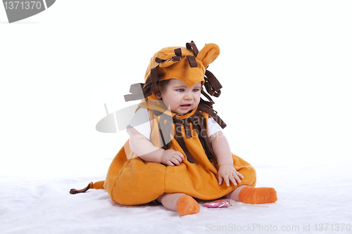 Image of Baby with a lion mask