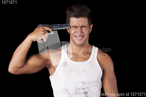 Image of Man aiming a handgun at his head