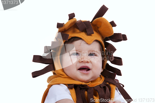 Image of Baby with a lion mask