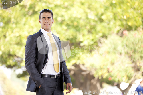 Image of Modern businessman at the city park