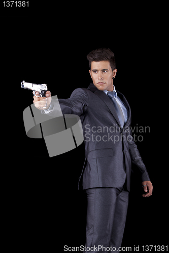 Image of Businessman aiming a handgun