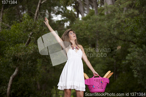 Image of Woman with bread in the basket