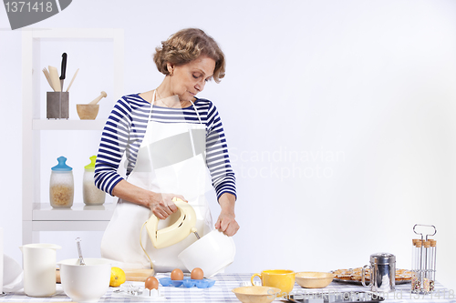 Image of Senior woman cooking