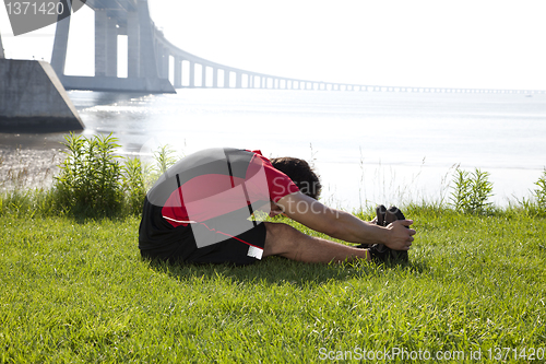 Image of Athlete warming and stretching