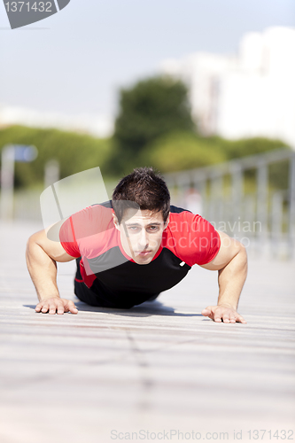 Image of Athlete man making pushups