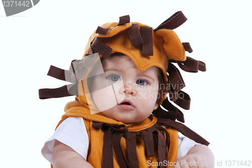 Image of Baby with a lion mask