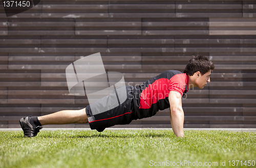 Image of Athlete man making pushups