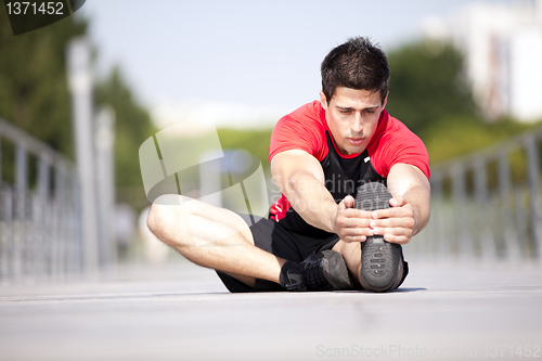 Image of Athlete warming and stretching