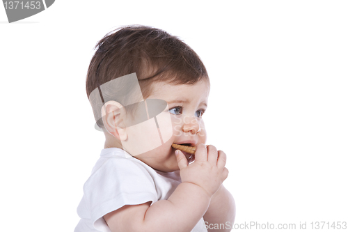 Image of Baby boy eating a cookie