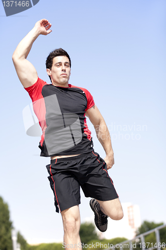 Image of Athlete jumping at the park