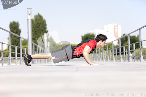 Image of Athlete man making pushups