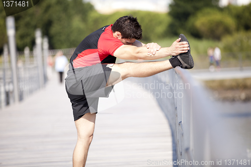 Image of Athlete warming and stretching