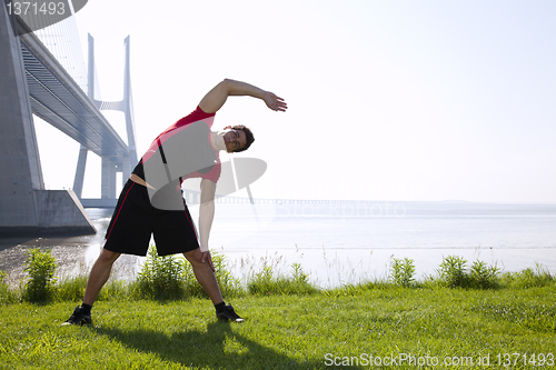 Image of Athlete warming and stretching