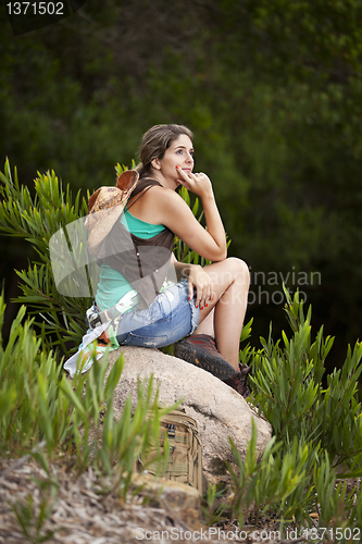 Image of Woman hiking at the forest