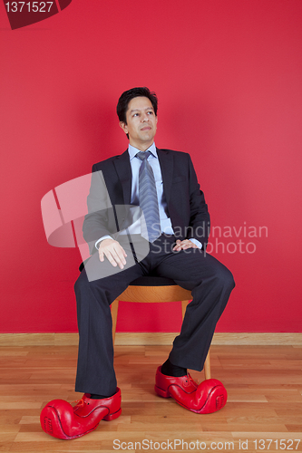 Image of Businessman with clown shoes