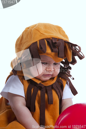 Image of Baby with a lion mask