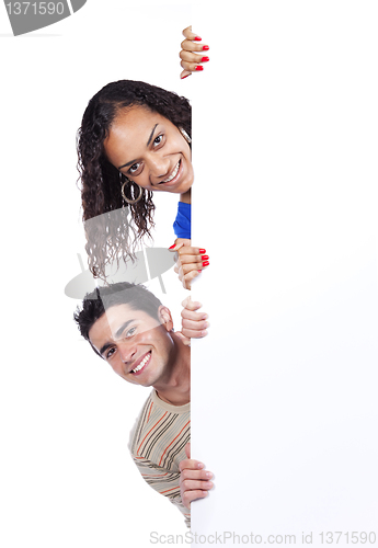 Image of Multiracial couple holding a blank banner