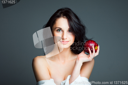 Image of Sexy young woman with fresh red apple