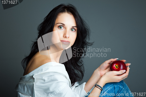 Image of Sexy young woman with fresh red apple