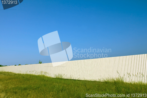 Image of Long white metal fence