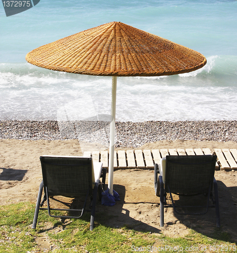 Image of Beach chairs and umbrella