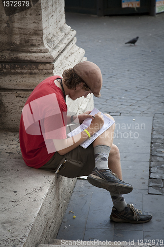 Image of Young tourist resting