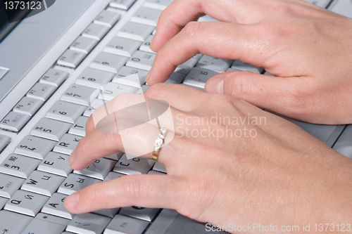 Image of  hand on laptop  computer