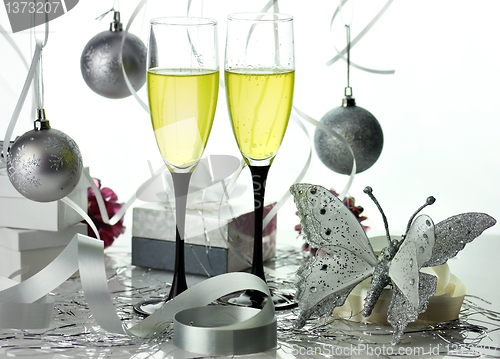 Image of Glasses of champagne with christmas decorations 