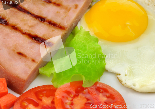 Image of Sliced grilled ham with egg and vegetables